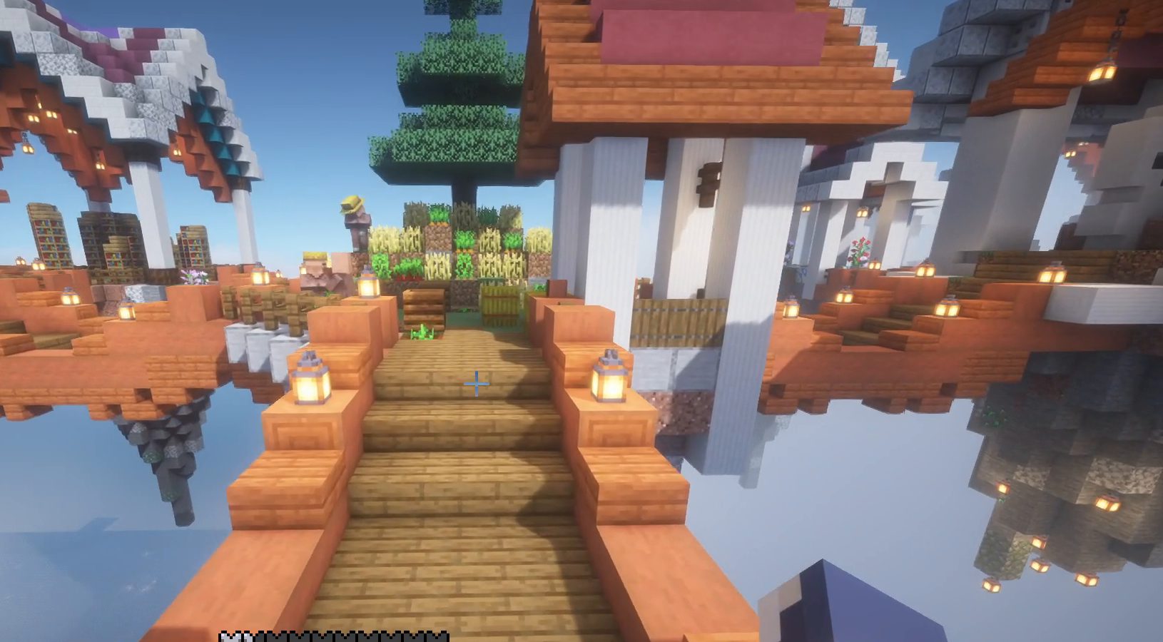 Capture de jeu : un pont de bois mène à des maisons aux toits rouges